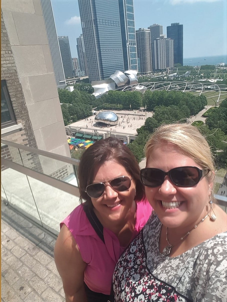 girls at rooftop bar overlooking Chicago