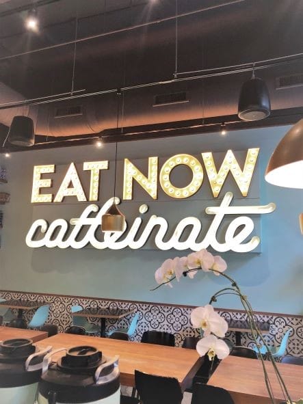 Eat Now Caffeinate Sign in Chicago