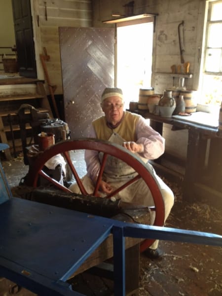 man at a large wheel