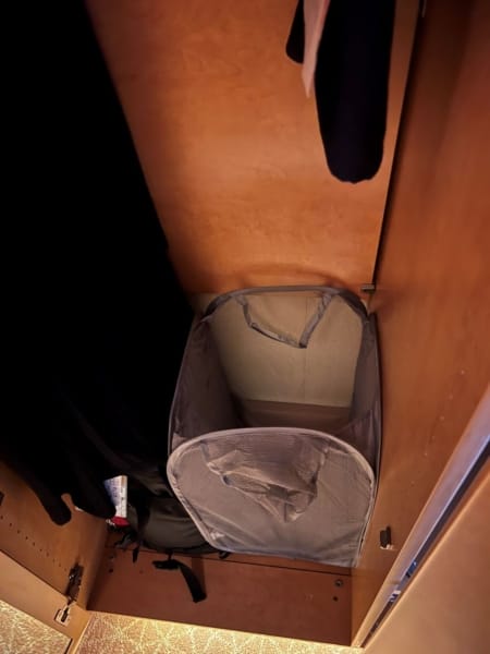 laundry hamper in cruise cabin closet