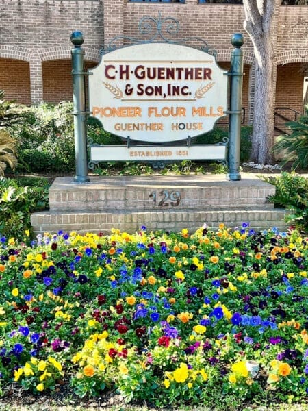 San Antonio Guenther House sign with flowers