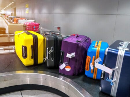 stacks of luggage on a carousel