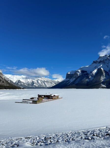 Lake Minnewanka frozen over in winter in Banff National Park