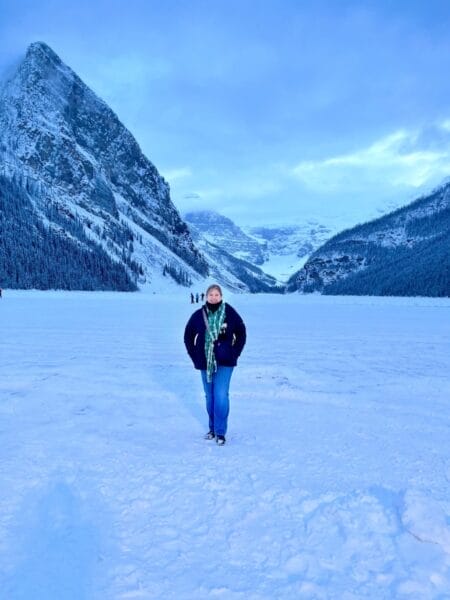 Michele standing on frozen Lake Louise