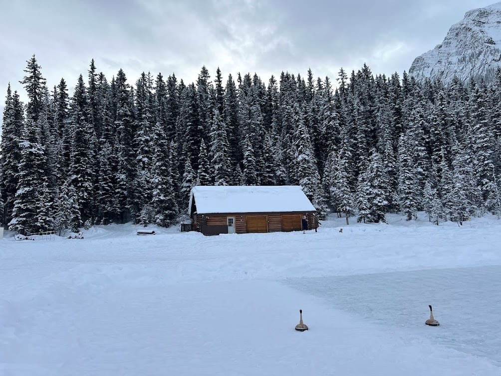 Log cabin along Lake Louise shore at Fairmont