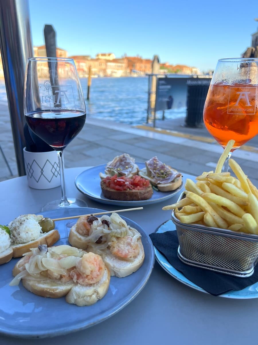 cichetti and spritz overlooking canal