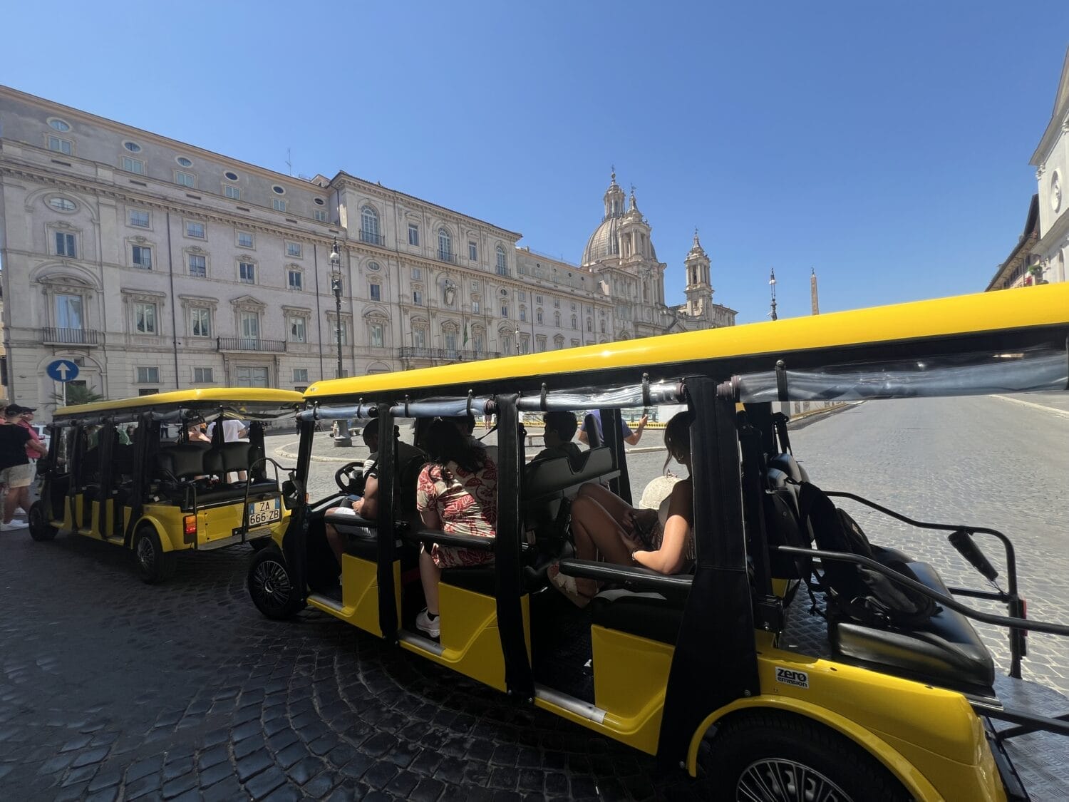 golf cart with Piazza Navona behind it