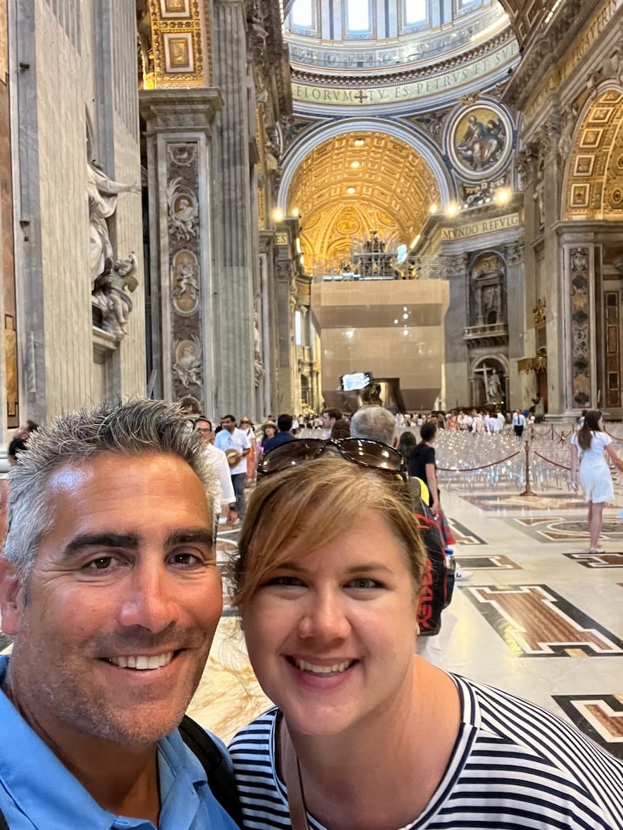 man and woman on tour in St Peters Basilica