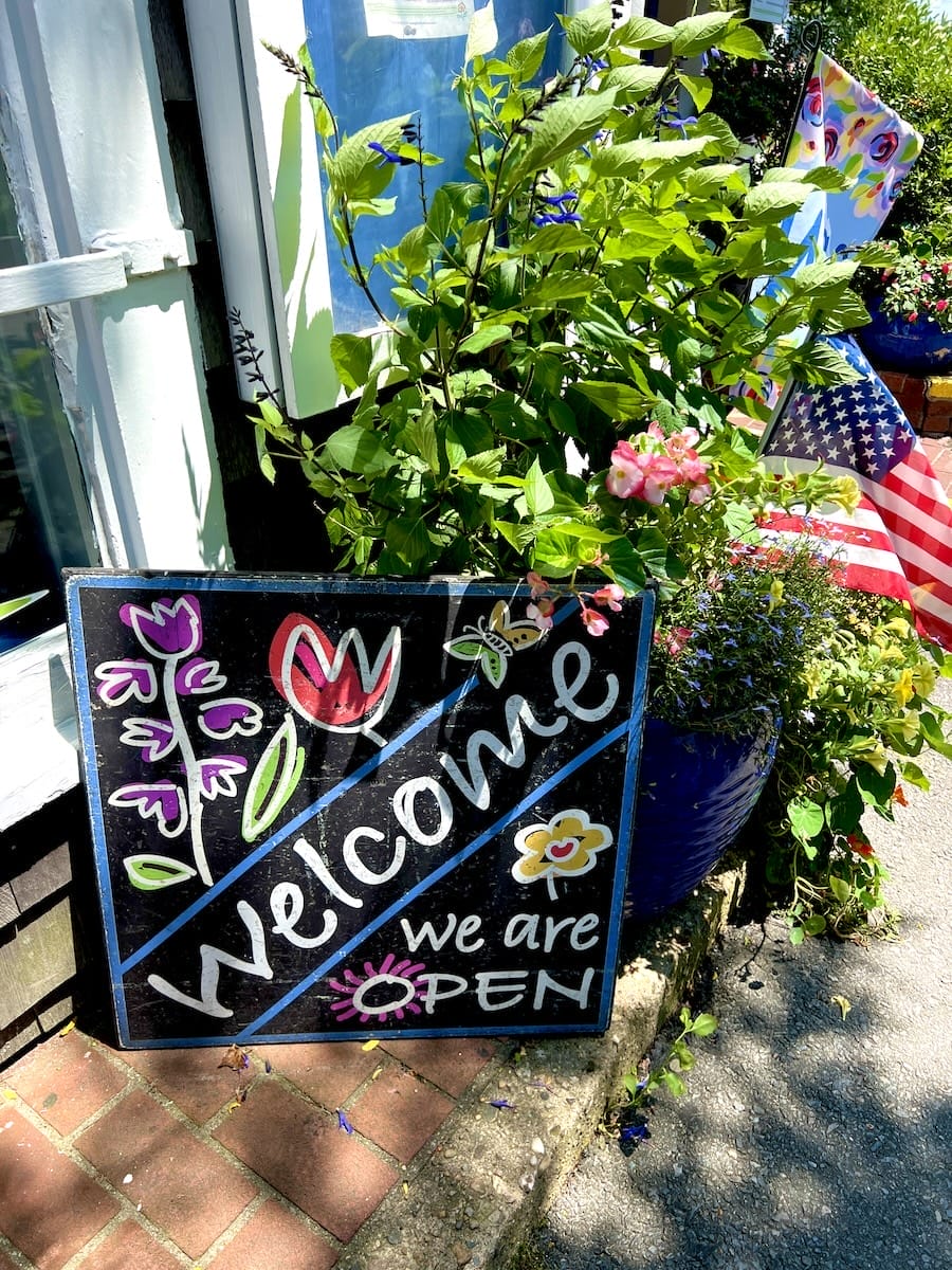 Welcome sign for Among the Flowers Cafe