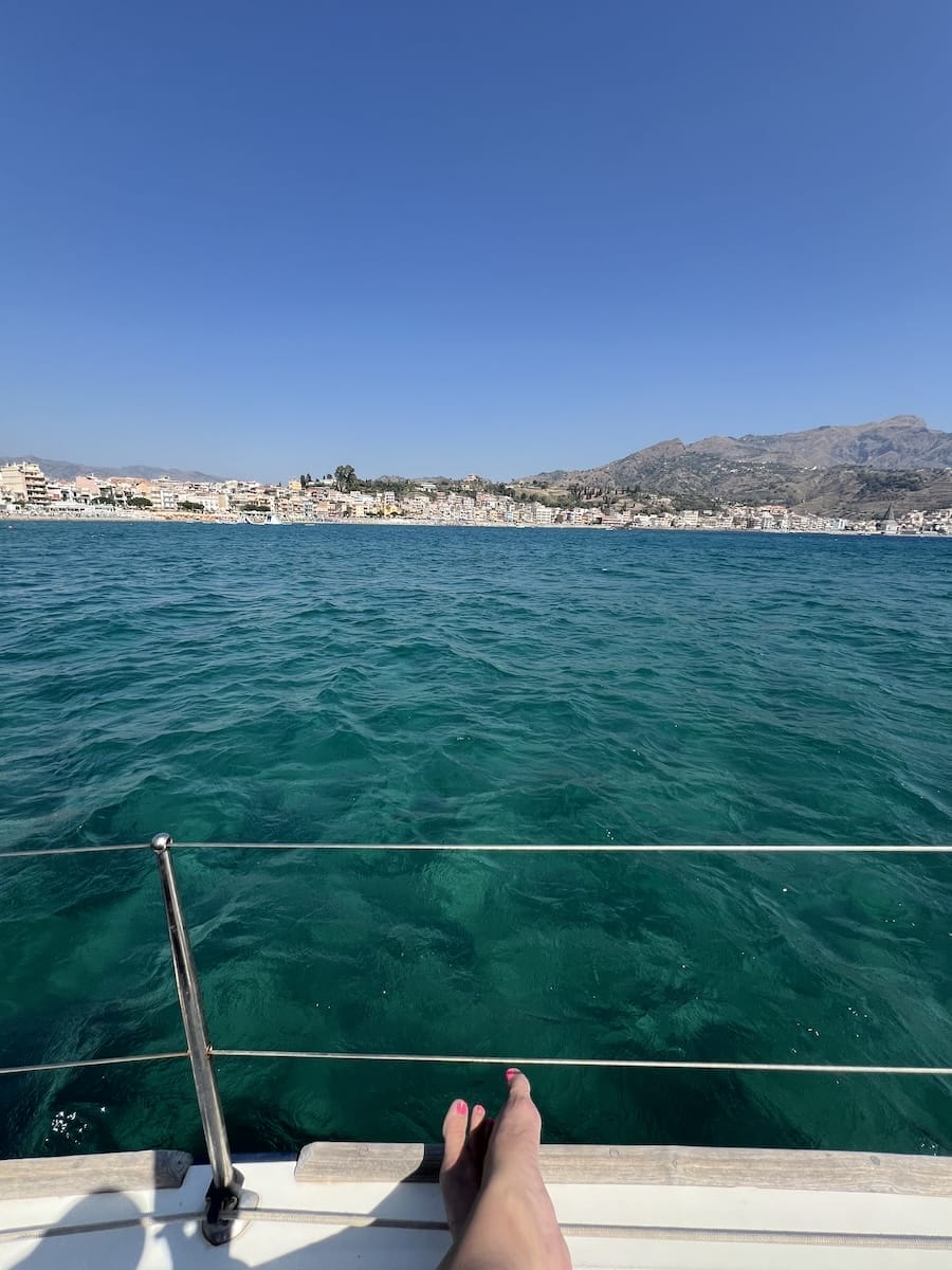 me looking over water from sailboat in Sicily
