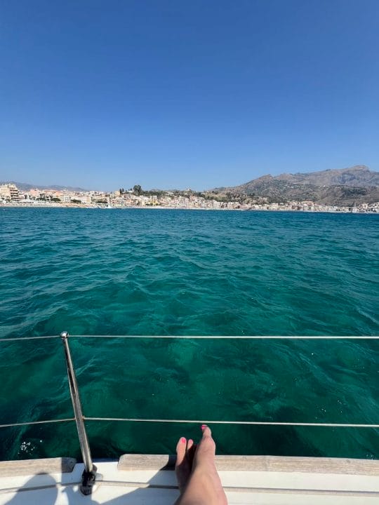 me looking over water from sailboat in Sicily
