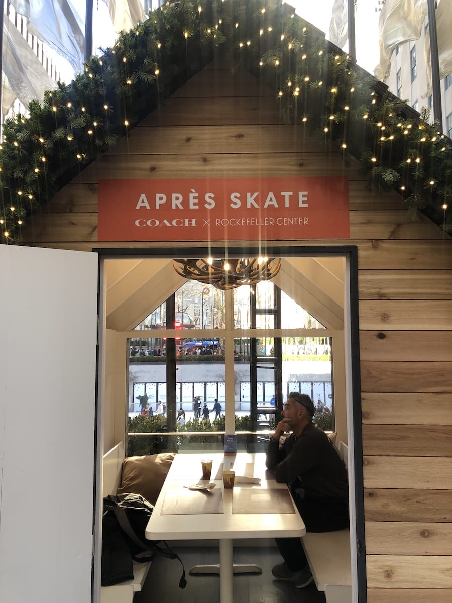 Rockefeller Center chalet with man inside